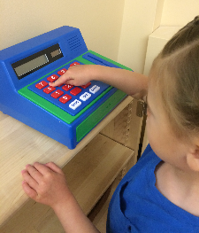 child with cash register